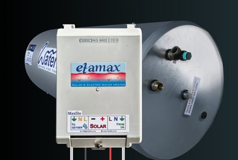 People show peace signs at a demonstration with green ribbons and backdrop cranes.