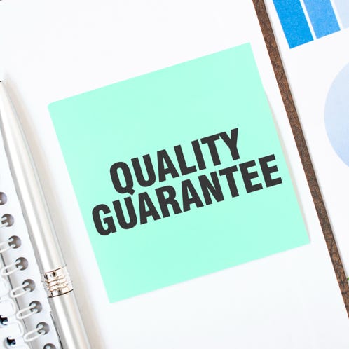 Solar panels and wind turbine in a snowy landscape, showcasing renewable energy sources.